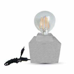 Λάμπα LED με ορατό νήμα σε μαρμάρινη βάση και καλώδιο ρεύματος, μοντέρνος φωτισμός χώρου.